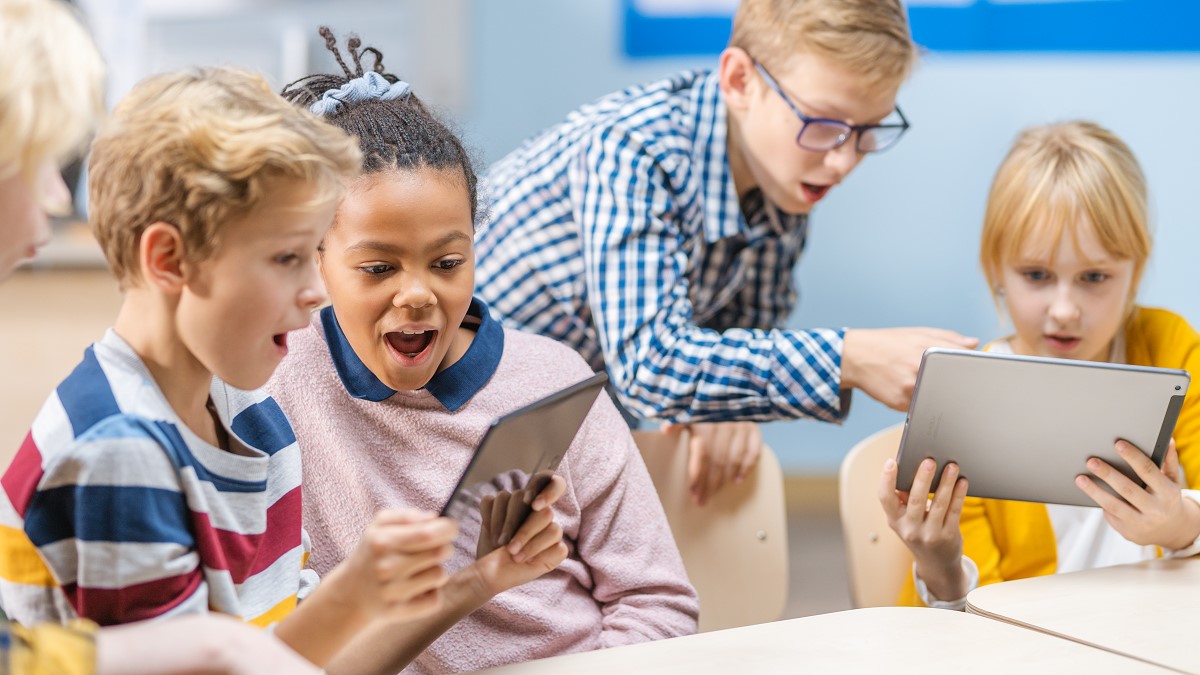 kid playing with tablets